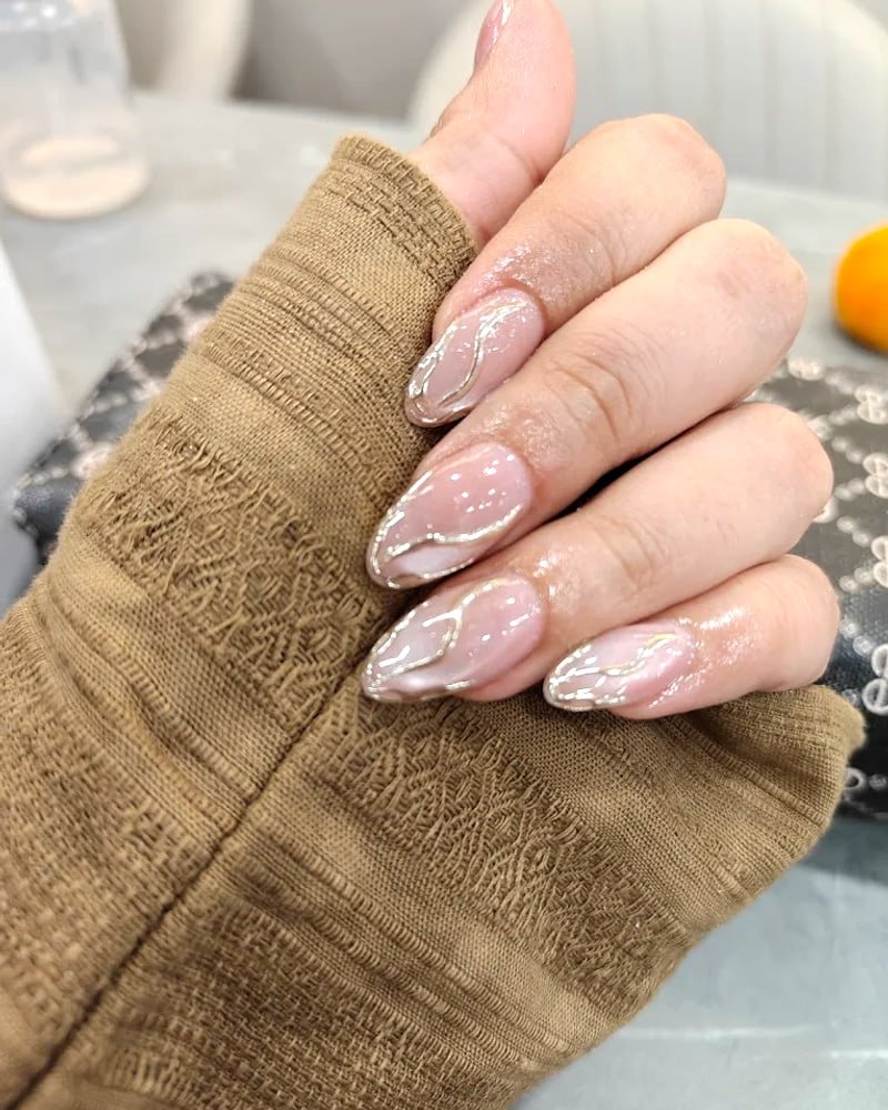 Soft nude almond gel nail extensions